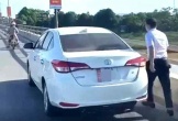 Danh tính người đàn ông dừng oto trên cầu làm hành động khiến nhiều người bức xúc